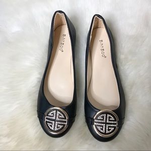 Black leather flats